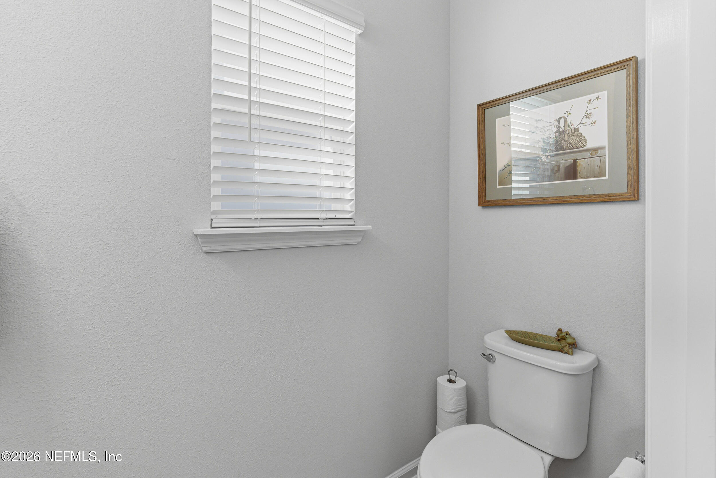 507 Narrowleaf Drive St. Johns, FL 32259 - Photo 18 of 79 a white toilet sitting next to a small window