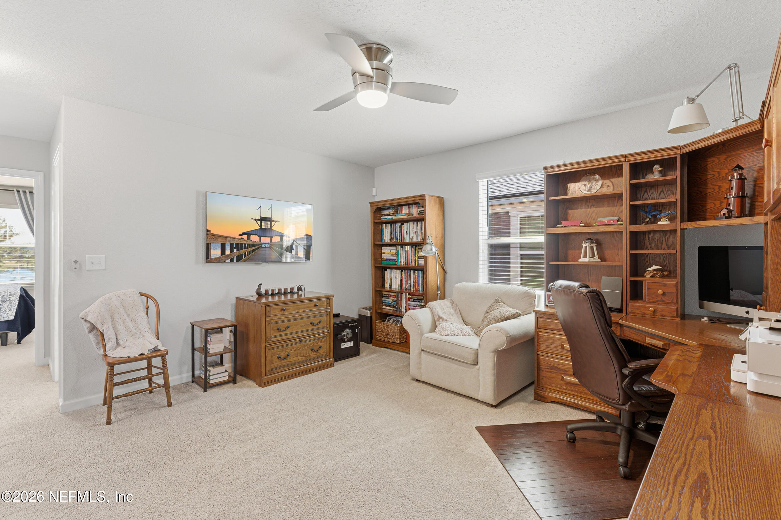507 Narrowleaf Drive St. Johns, FL 32259 - Photo 19 of 79 a living room with furniture and a flat screen tv
