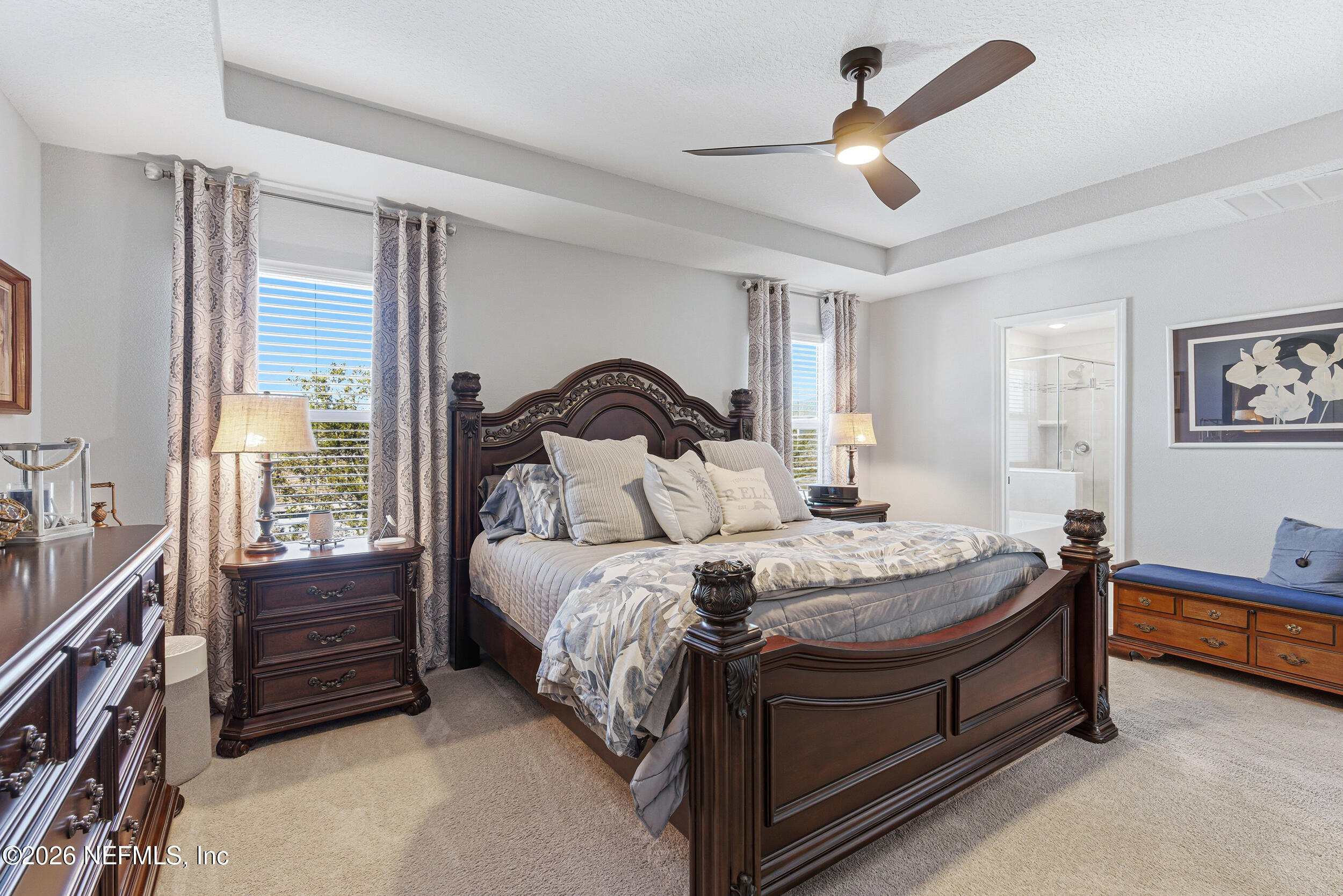 507 Narrowleaf Drive St. Johns, FL 32259 - Photo 23 of 79 a bedroom with a bed and a chandelier