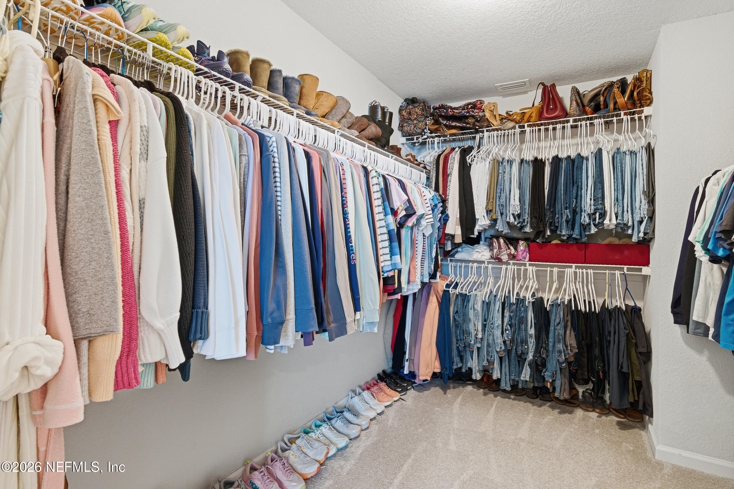 507 Narrowleaf Drive St. Johns, FL 32259 - Photo 26 of 79 a view of walk in closet with clothes