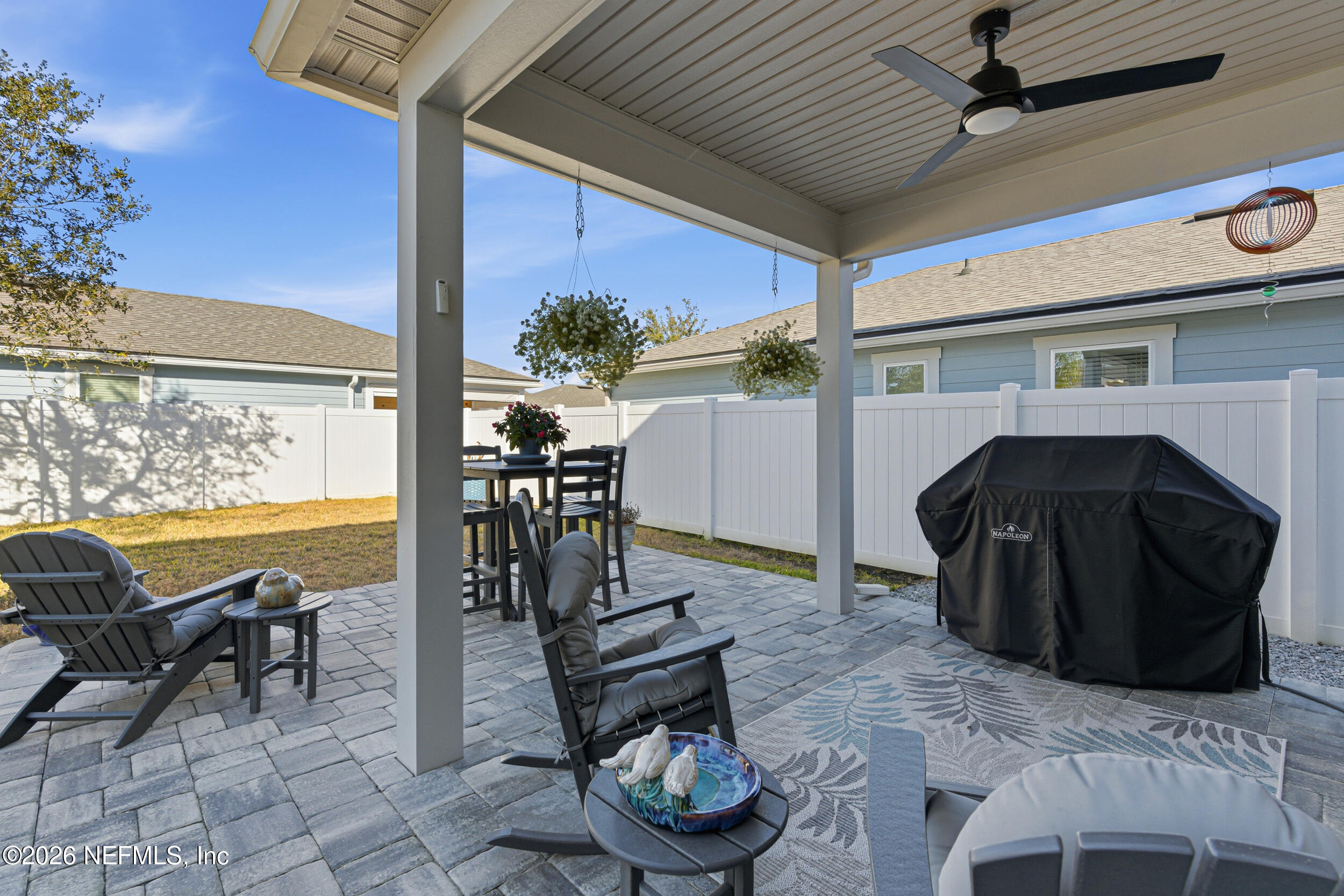 507 Narrowleaf Drive St. Johns, FL 32259 - Photo 29 of 79 a view of a patio with table and chairs and potted plants