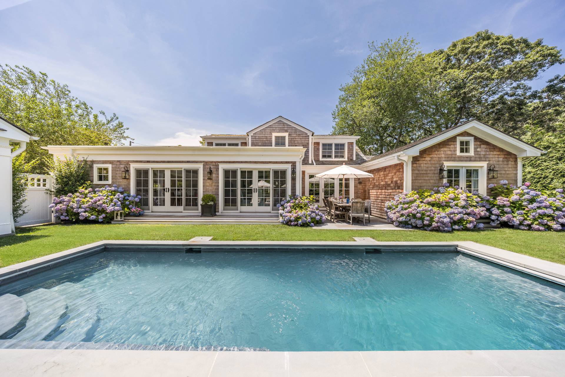 29 Cornell Road Sag Harbor, NY 11963 - Photo 1 of 26 a view of a house with swimming pool and a yard