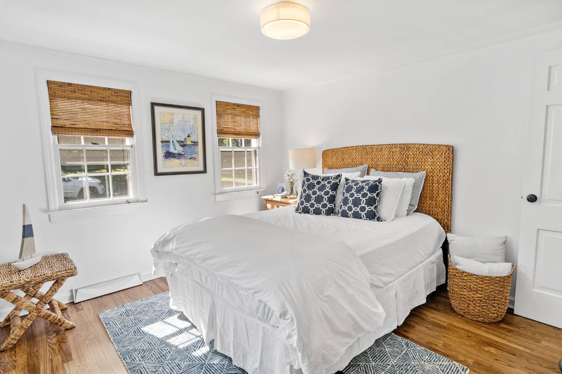 29 Cornell Road Sag Harbor, NY 11963 - Photo 12 of 26 a bedroom with a bed and wooden floor