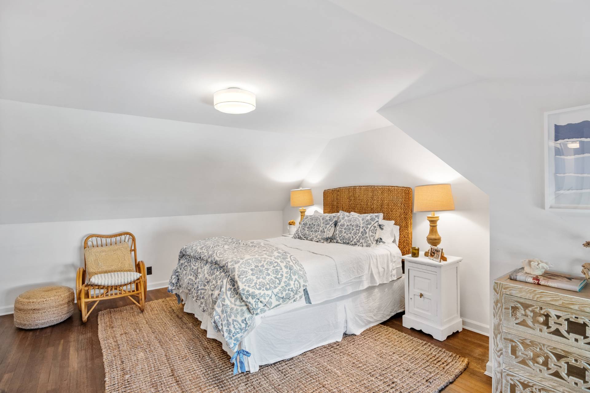 29 Cornell Road Sag Harbor, NY 11963 - Photo 14 of 26 a bedroom with a bed and wooden floor