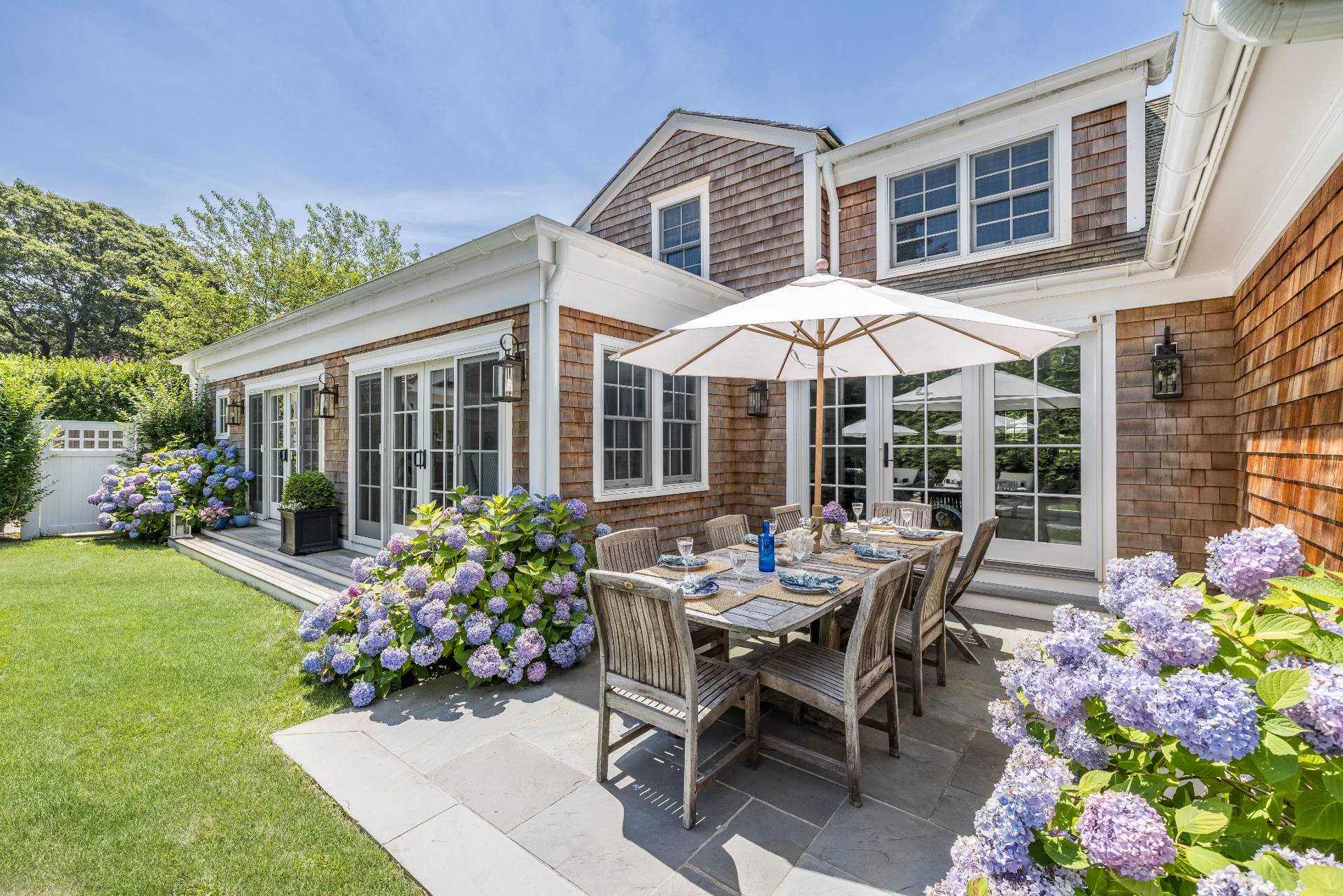 29 Cornell Road Sag Harbor, NY 11963 - Photo 19 of 26 a view of a house with backyard sitting area and garden