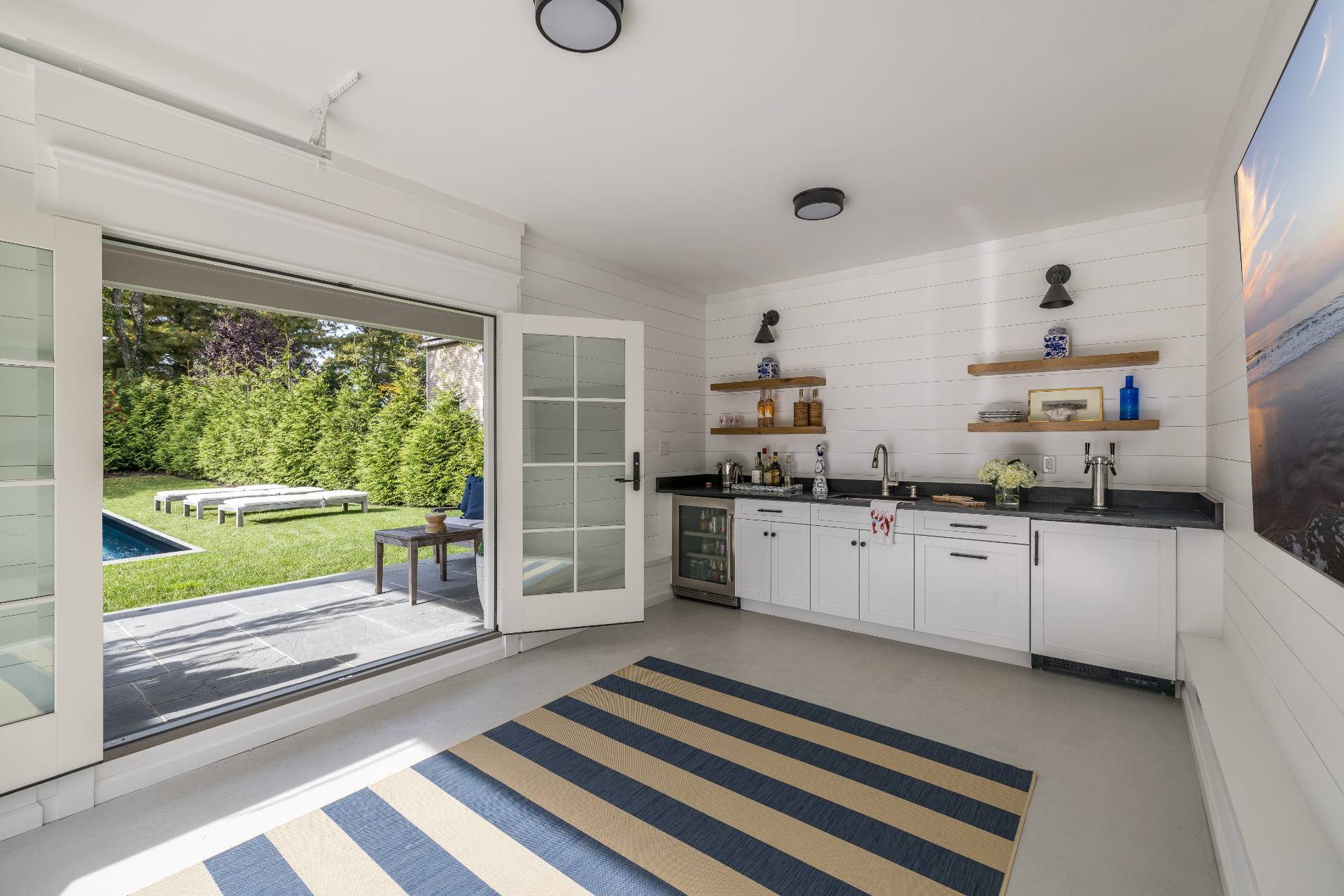 29 Cornell Road Sag Harbor, NY 11963 - Photo 25 of 26 a kitchen with sink cabinets and outdoor view