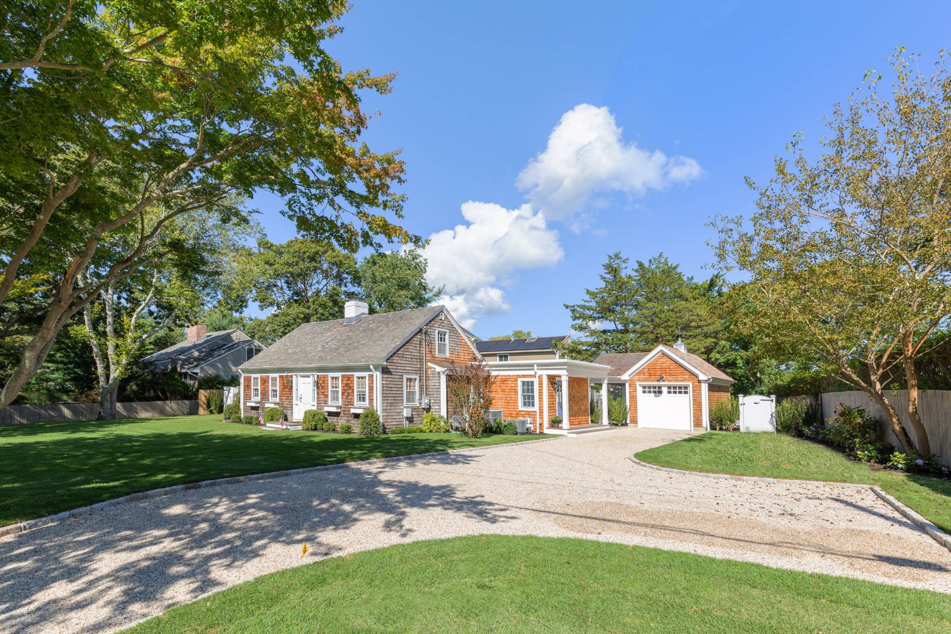 29 Cornell Road Sag Harbor, NY 11963 - Photo 26 of 26 a front view of a house with a yard and garage