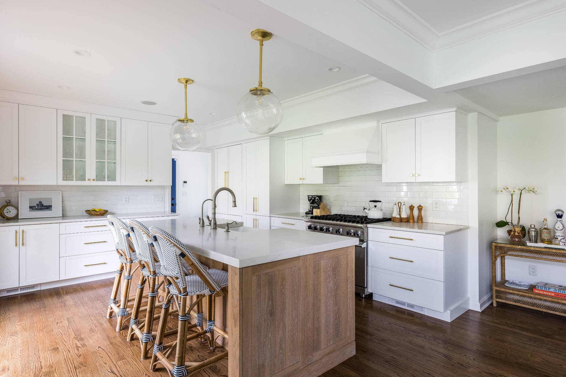 29 Cornell Road Sag Harbor, NY 11963 - Photo 7 of 26 a kitchen with stainless steel appliances granite countertop a stove a sink dishwasher a refrigerator white cabinets with wooden floor