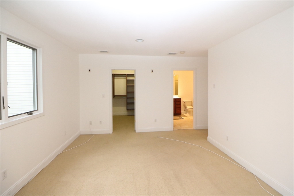 141 Grovers Avenue, Unit 141 Winthrop, MA 02152 - Photo 15 of 21 a view of an empty room with a window