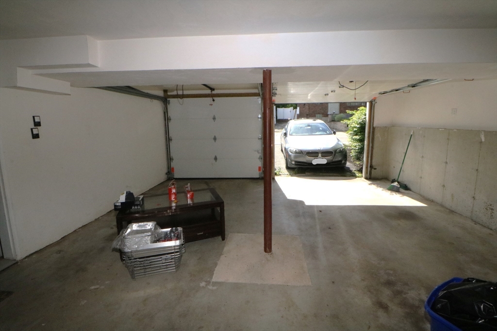 141 Grovers Avenue, Unit 141 Winthrop, MA 02152 - Photo 18 of 21 a car parked in a garage