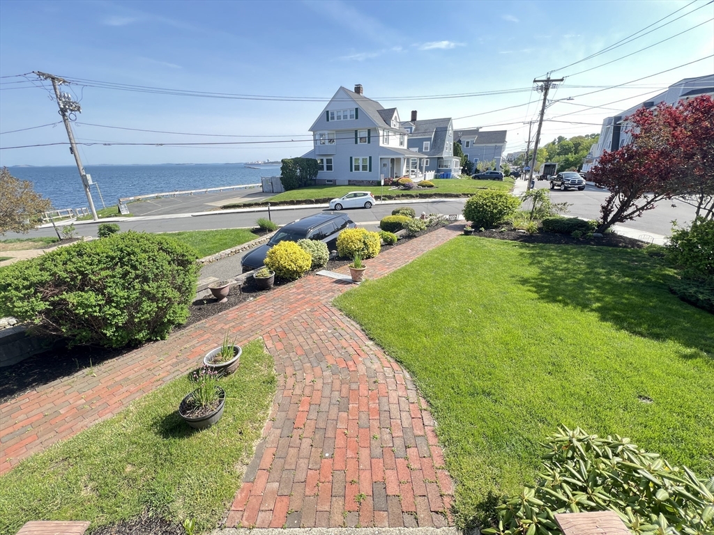 141 Grovers Avenue, Unit 141 Winthrop, MA 02152 - Photo 2 of 21 a view of a swimming pool with a yard