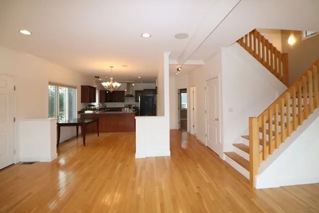 a view of kitchen with furniture and a wooden floor