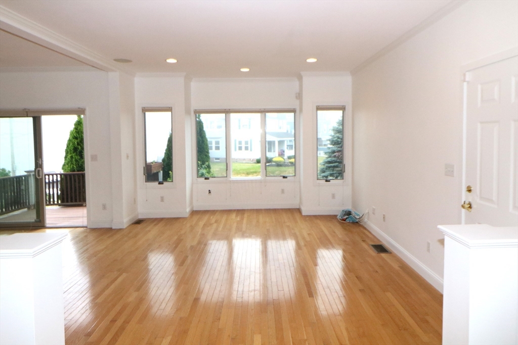 141 Grovers Avenue, Unit 141 Winthrop, MA 02152 - Photo 6 of 21 a view of an empty room and window