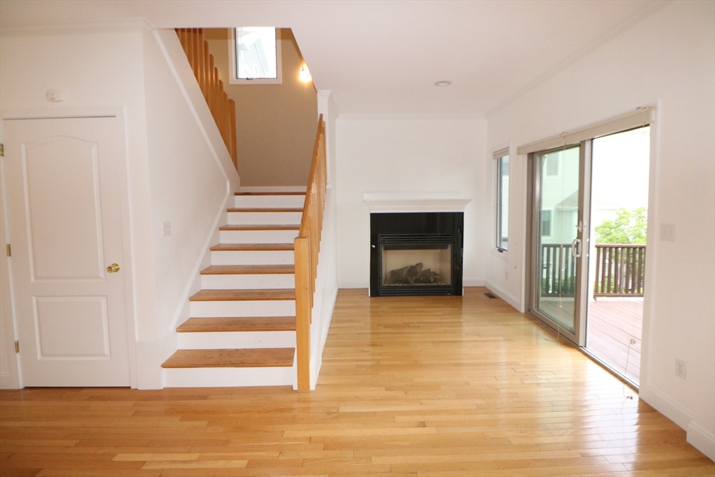 141 Grovers Avenue, Unit 141 Winthrop, MA 02152 - Photo 9 of 21 a view of entryway and hall with wooden floor