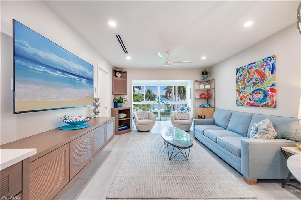 1021 3rd Street South, Unit 310 Naples, FL 34102 - Photo 9 of 27 Living area featuring ceiling fan and recessed lighting