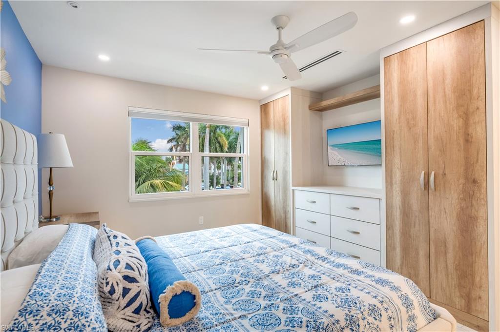 1021 3rd Street South, Unit 310 Naples, FL 34102 - Photo 12 of 27 Bedroom featuring multiple closets, ceiling fan, and recessed lighting