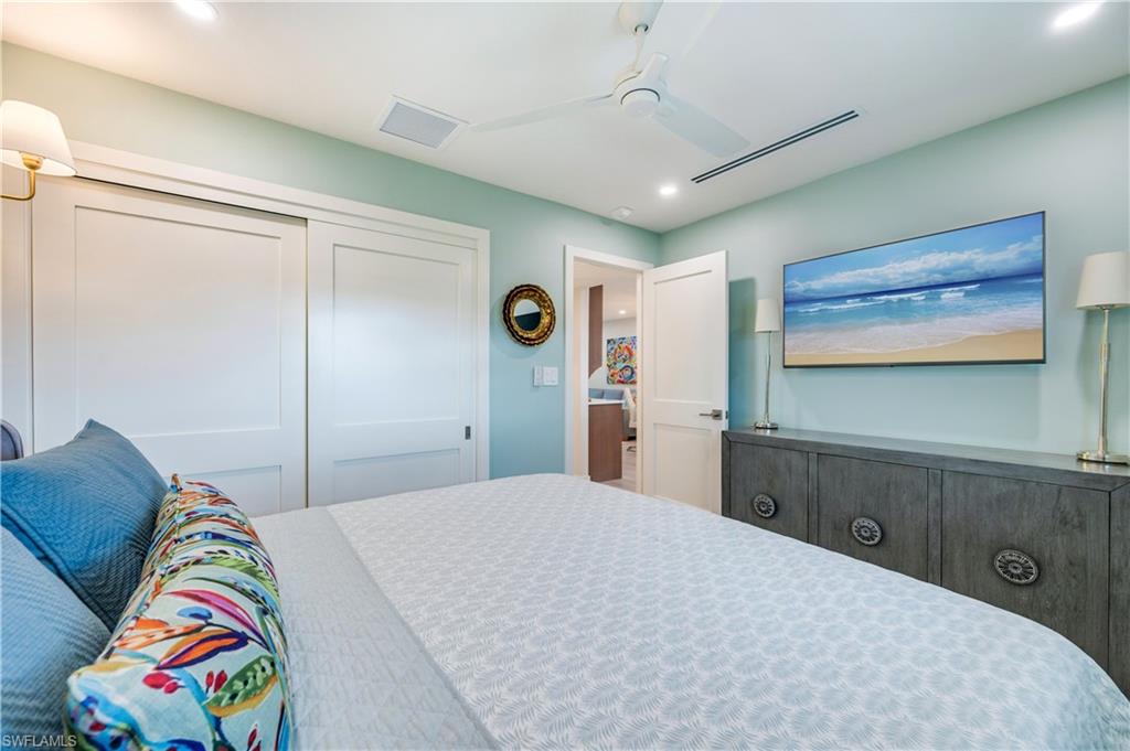 1021 3rd Street South, Unit 310 Naples, FL 34102 - Photo 16 of 27 Bedroom with recessed lighting, a closet, and ceiling fan