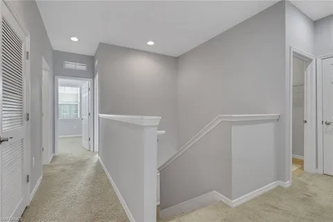 a view of a hallway with closet and entryway
