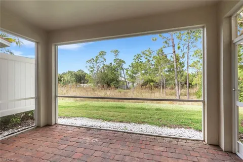a view of a back yard from a room