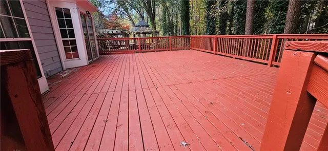 a view of deck with wooden floor and outdoor seating