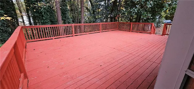 a view of balcony with wooden floor