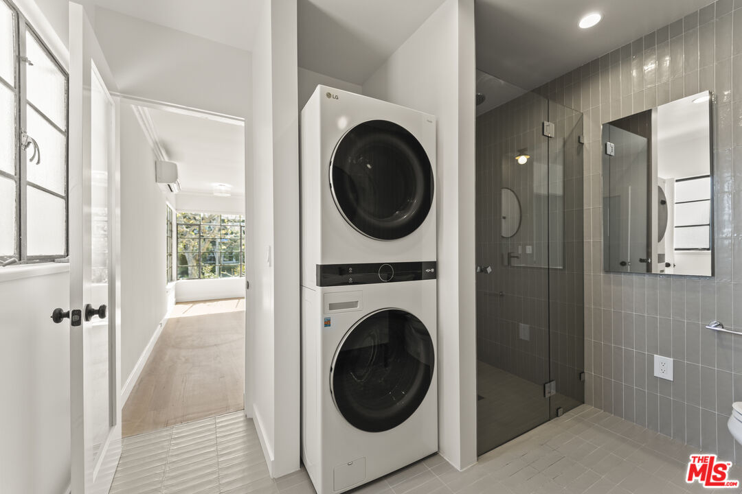 751 18th Street, Unit B Santa Monica, CA 90403 - Photo 15 of 24 a view of a hallway with washer and dryer