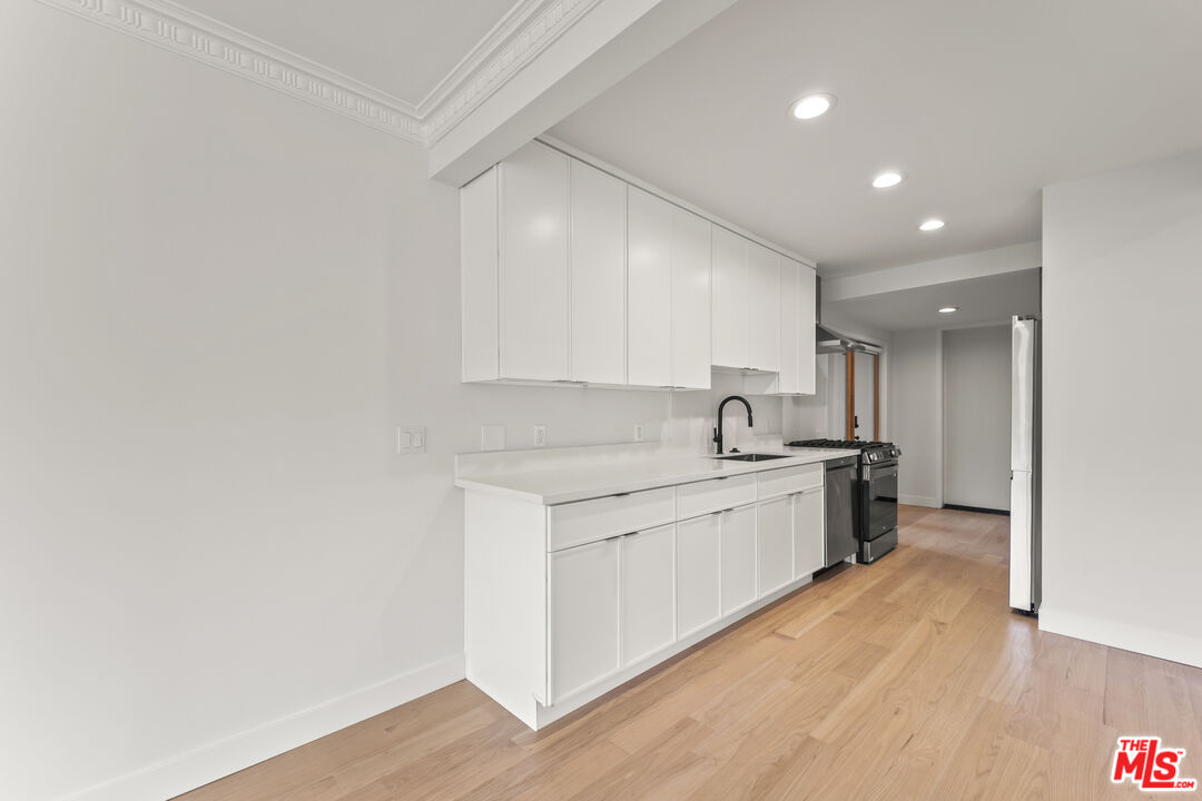 751 18th Street, Unit B Santa Monica, CA 90403 - Photo 10 of 24 a view of a kitchen with electric appliances