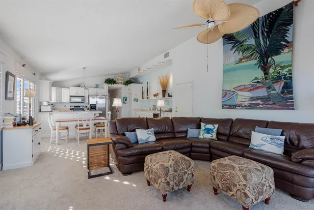 a kitchen with cabinets and wooden floor