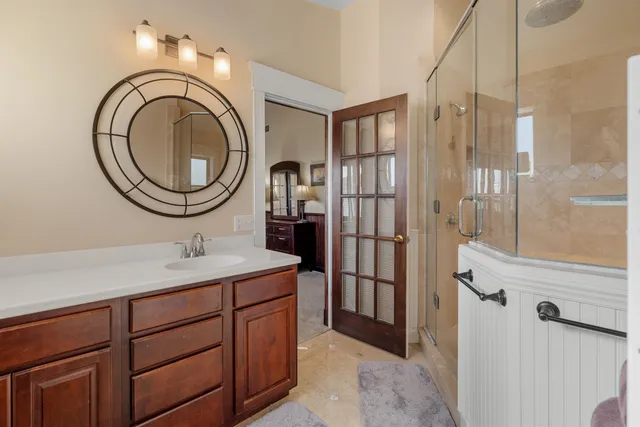 a bedroom with furniture and a window