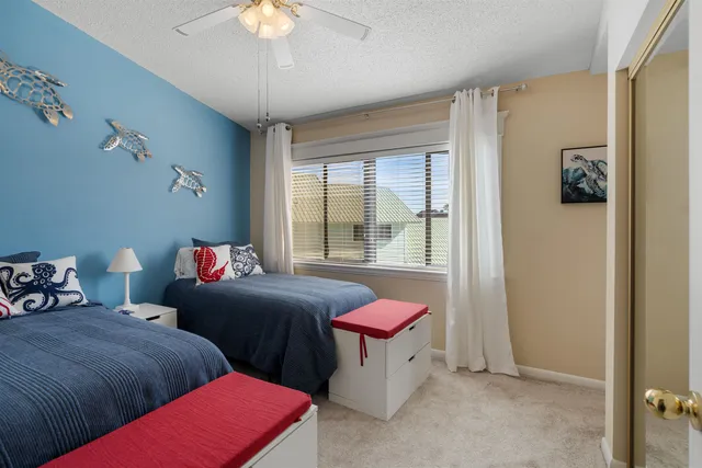 a bedroom with furniture and a chandelier