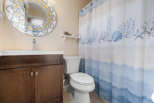 a bathroom with a toilet and a sink