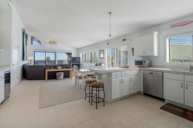 a kitchen with cabinets and stainless steel appliances