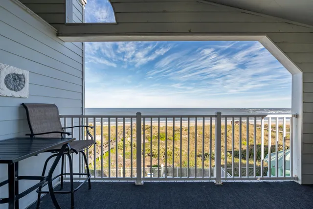 a view of a balcony with chairs