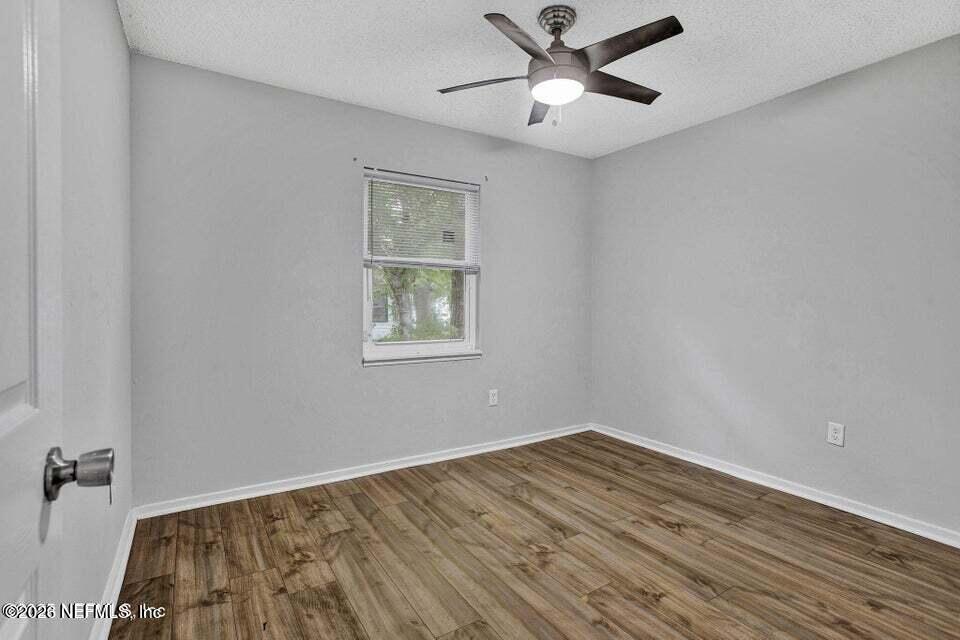 3645 Edison Avenue Jacksonville, FL 32254 - Photo 19 of 21 wooden floor in an empty room with a window