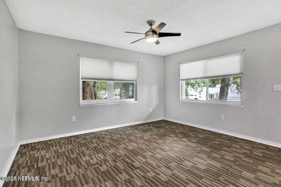 3645 Edison Avenue Jacksonville, FL 32254 - Photo 20 of 21 a view of empty room with wooden floor and fan