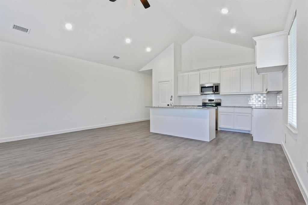 718 West Texas Street Denison, TX 75020 - Photo 22 of 22 a view of kitchen with wooden floor