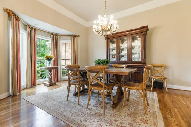 a bedroom with furniture and a large window