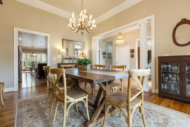 a bedroom with a bed and flat tv screen on dresser
