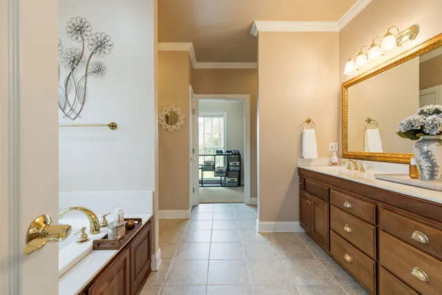 a dining room with furniture a chandelier and wooden floor