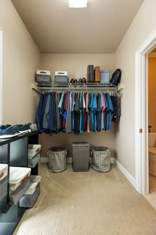 a view of a dining room with furniture a chandelier and wooden floor