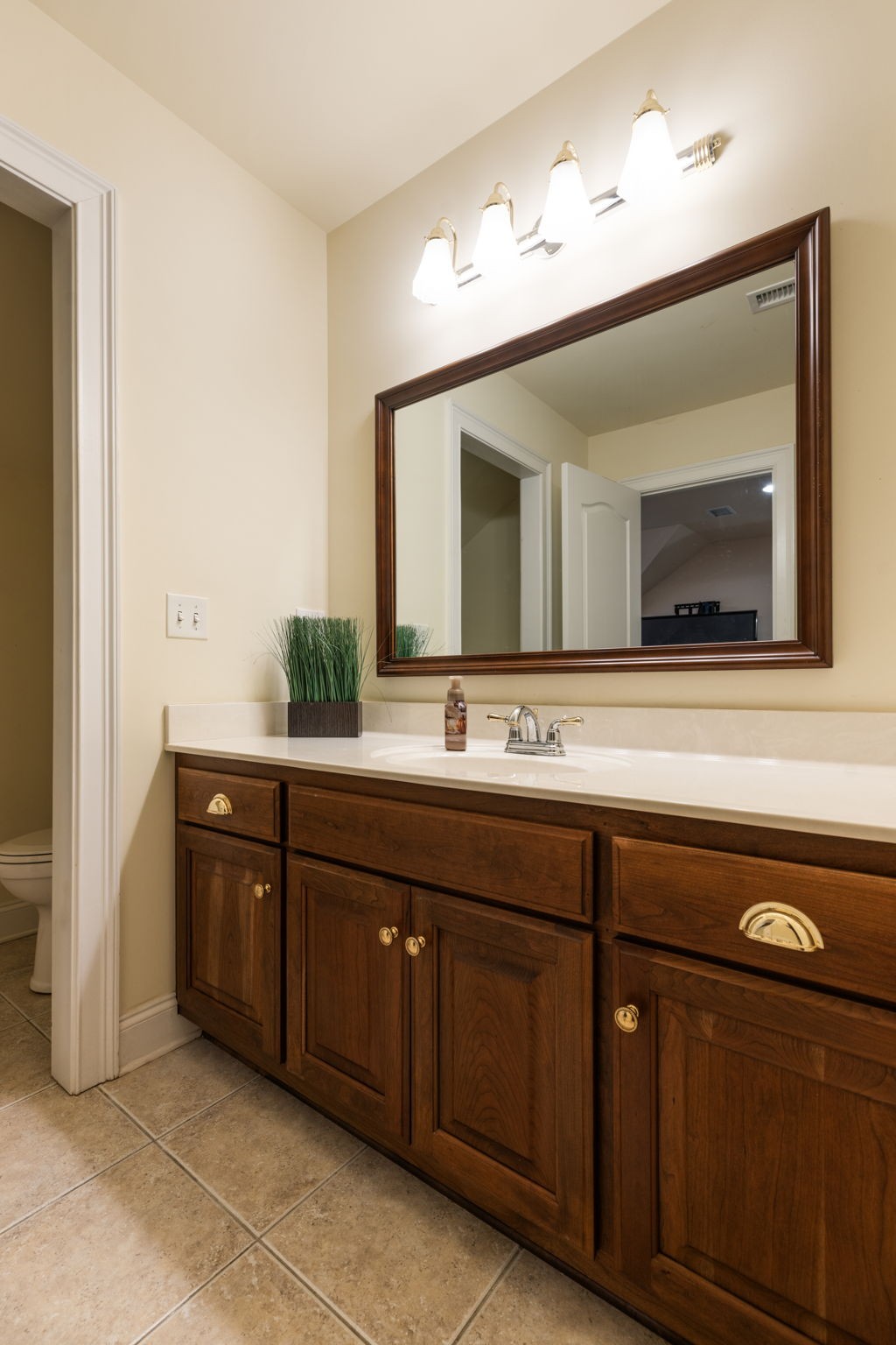 116 Courtside Lane Tullahoma, TN 37388 - Photo 67 of 90 a bathroom with a double vanity sink and a large mirror