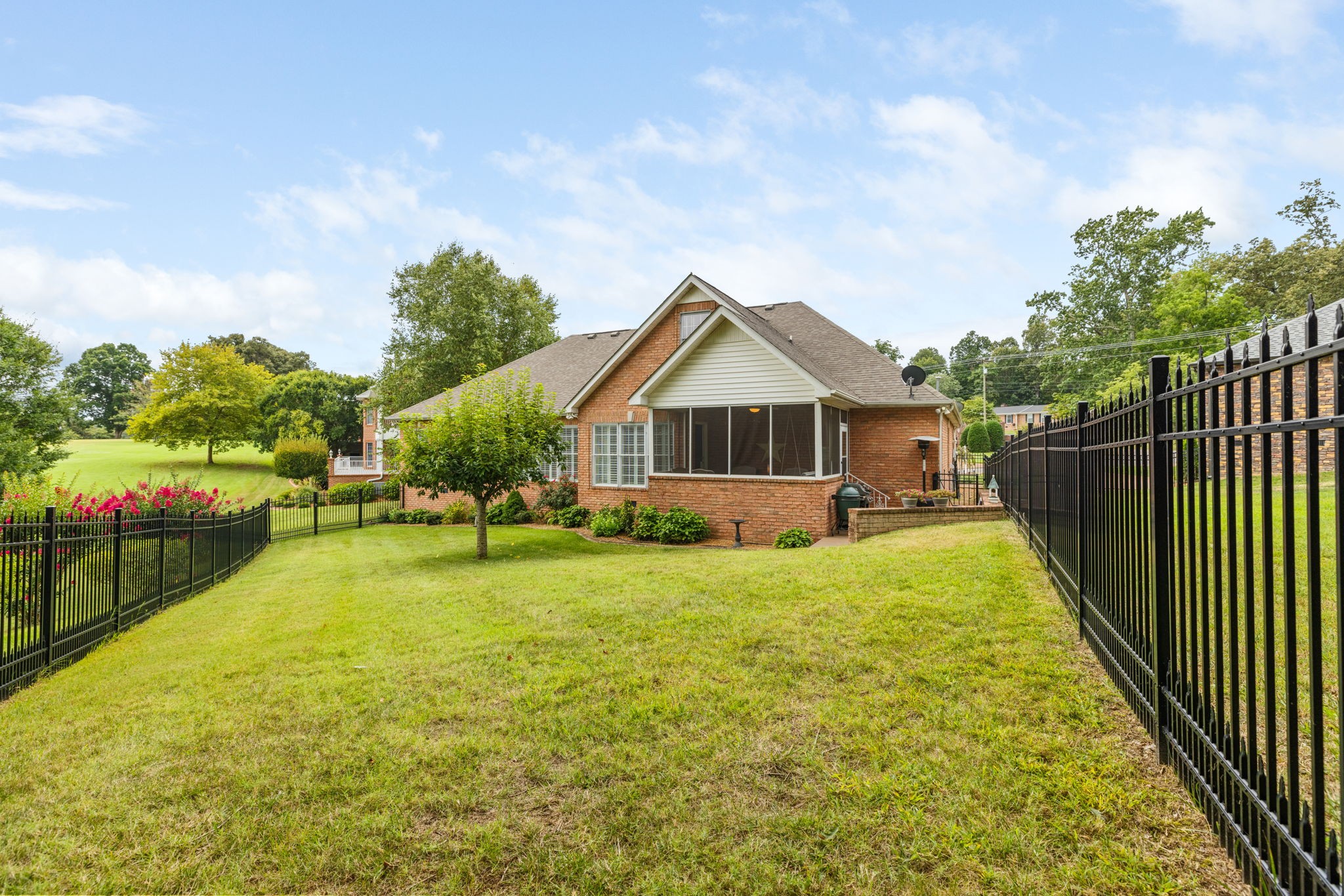 116 Courtside Lane Tullahoma, TN 37388 - Photo 77 of 90 a yellow house with swimming pool in front of it