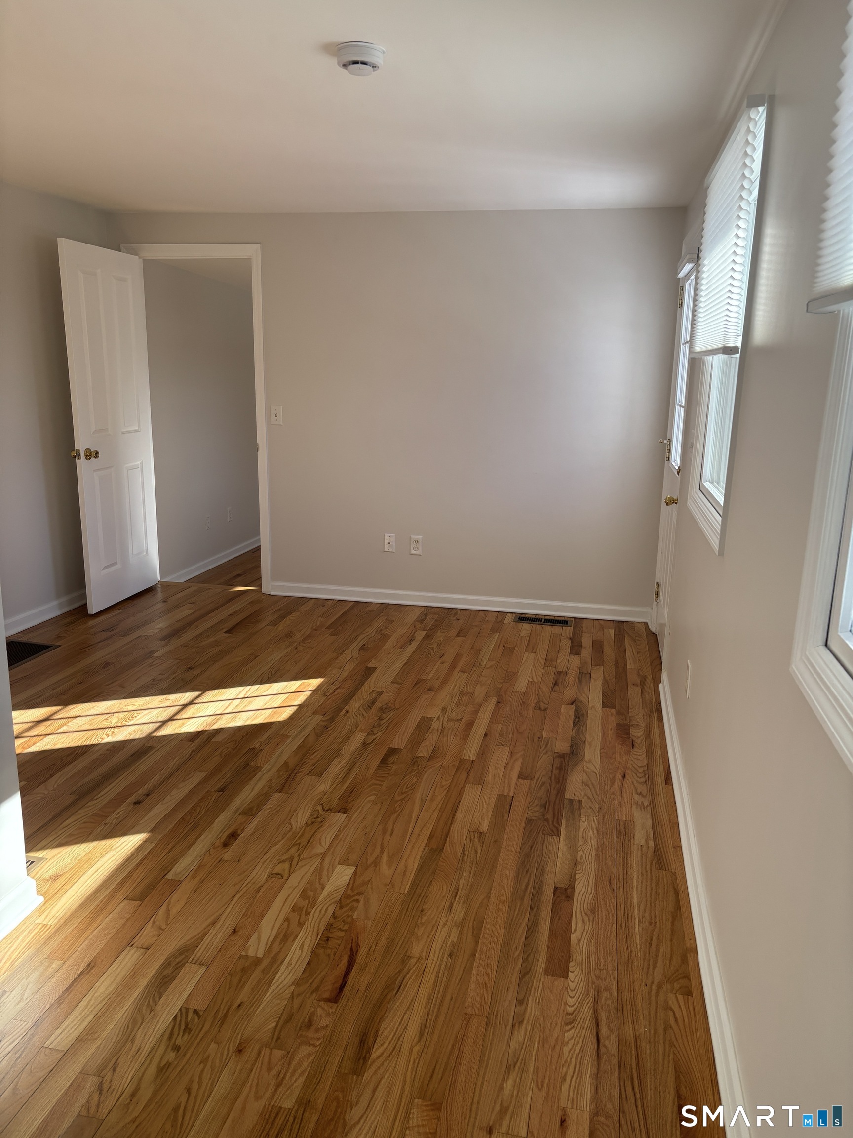 98 Ridgewood Avenue, Unit COTTAGE Stamford, CT 06907 - Photo 4 of 10 a view of room with wooden floor