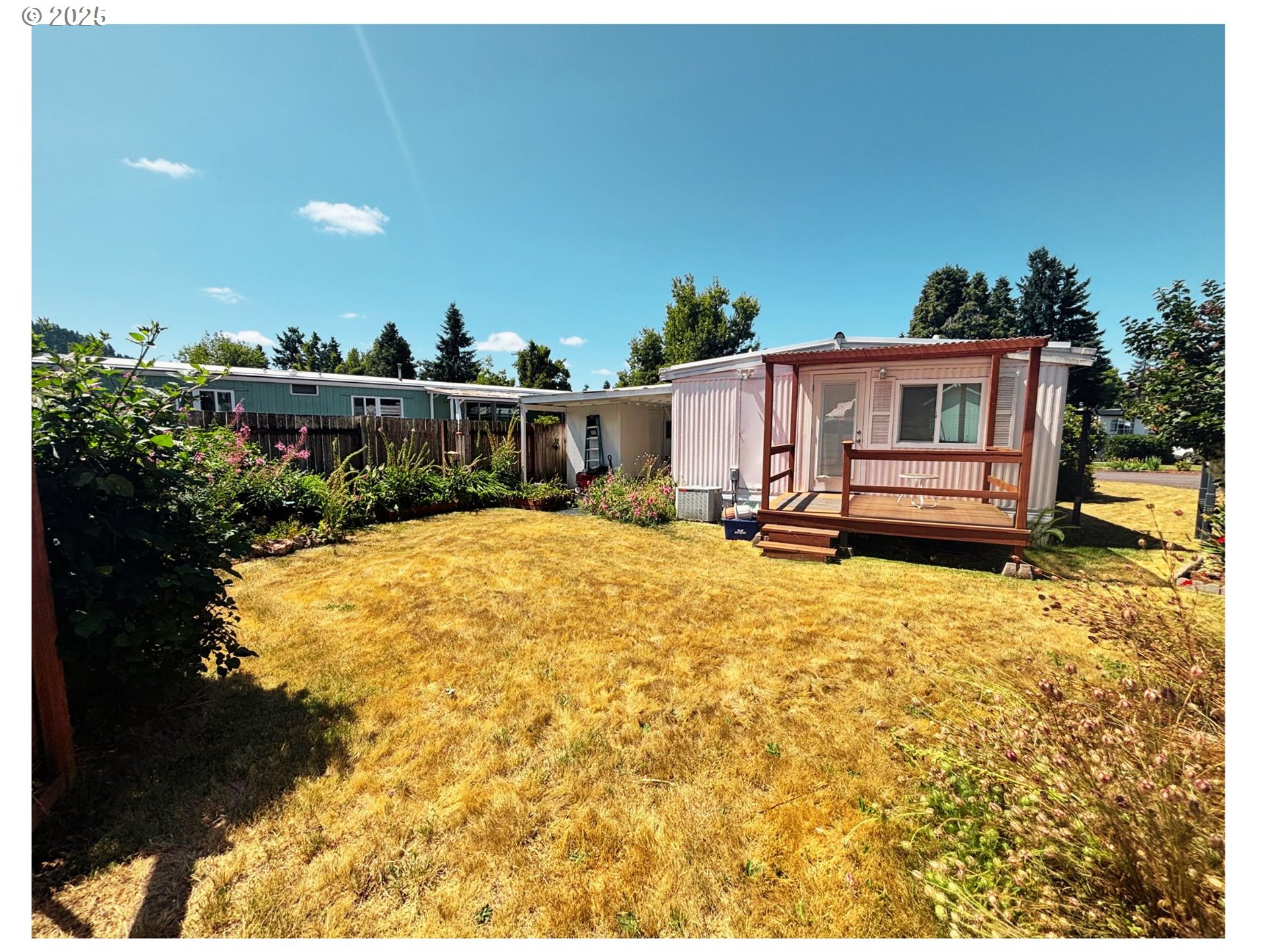 1125 58th Street, Unit 86 Springfield, OR 97478 - Photo 29 of 44 a view of a house with a yard
