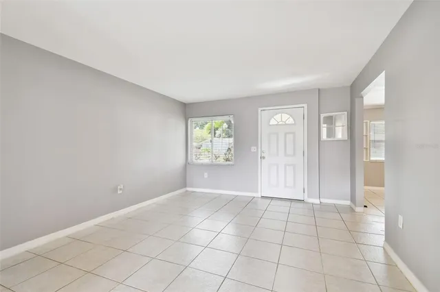 a kitchen with stainless steel appliances granite countertop a refrigerator and a stove
