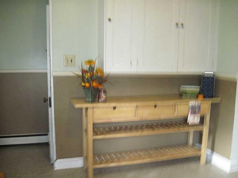 2515 Ridge Rd Extension Economy, PA 15005 - Photo 6 of 18 Kitchen. Addition wood work table for the busy chef is included with the home! Above storage.