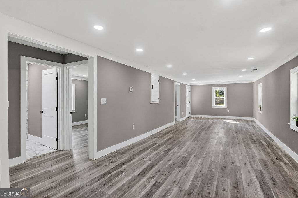 206 Walker Drive Monroe, GA 30655 - Photo 13 of 32 a view of empty room with wooden floor