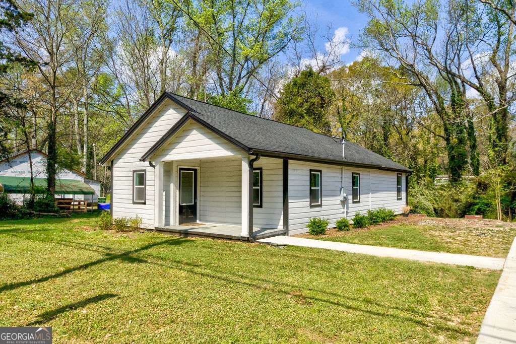 206 Walker Drive Monroe, GA 30655 - Photo 2 of 32 a front view of house with yard and green space