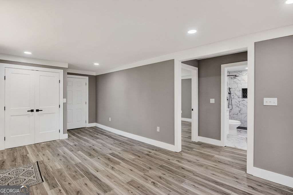206 Walker Drive Monroe, GA 30655 - Photo 24 of 32 wooden floor in an empty room with wooden floor