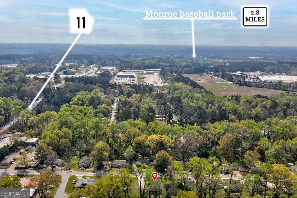 206 Walker Drive Monroe, GA 30655 - Photo 30 of 32 a aerial view of a house with a yard
